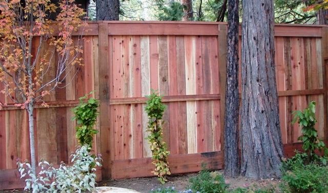 Redwood privacy with 6x6 post cap center rail 2x8 and 2x12 trim